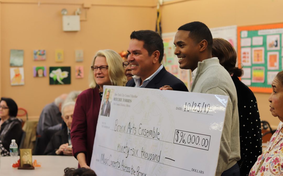 BAE Receives Check for Senior Concerts from Councilmember Ritchie Torres